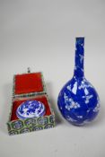 A Chinese blue and white porcelain stem bottle vase, featuring cherry blossom and hexagonal line