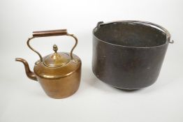 A Victorian copper kettle, 10" high, together with a copper cauldron with brass swing handle (2)