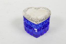 A blue glass, heart shaped trinket box with a sterling silver cover, 2½" x 2½"