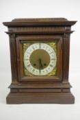 An Edwardian carved mahogany mantel clock by the Black Forest clockmakers Lenzkirch of Germany,