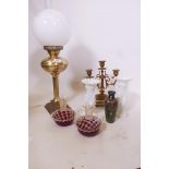A pair of opaline glass vases, 8" high, a three branch brass candelabrum, a brass table lamp, and
