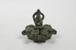 An Indian bronzed metal tikka spice box with Ganesh decoration, 2½" diameter