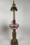 A Bohemian metal and glass table lamp in the form of an oil lamp with ribbed metal column and