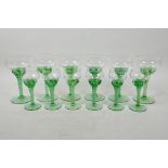 A set of six and six uranium wine and licquor glasses with spiral stems, A/F one chip and one