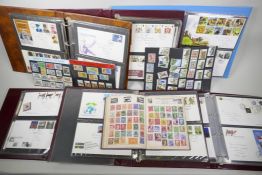 A World stamp album containing a large quantity of stamps, together with a collection of first day