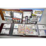 A World stamp album containing a large quantity of stamps, together with a collection of first day