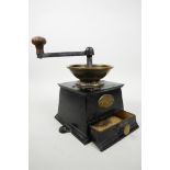 A large Victorian coffee grinder by Baldwin Son and Co, Stourport, in brass and cast iron, no.3