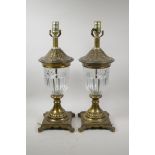 A pair of French brass table lamps with a moulded glass centre section, 20½" high