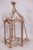 A gold painted wrought metal hall lantern, 33" long