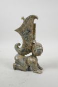 A Chinese jade carving of a figure with a horn shaped jue to back, 9" high