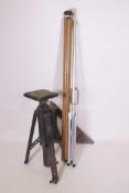A vintage wooden tripod together with an early projector screen and a wooden triangle (3)