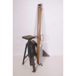 A vintage wooden tripod together with an early projector screen and a wooden triangle (3)