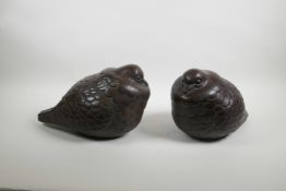 A pair of Eastern lacquered terracotta figures of pigeons, 13" long