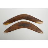 An Australian hardwood boomerang with banded Aboriginal kangaroo and platypus decoration, and