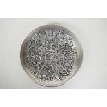 A Chinese white metal dish with raised decoration of Buddha and other deities, impressed seal mark