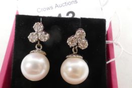 A pair of 18ct white gold, diamond and cultured pearl drop earrings