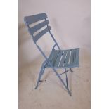 A set of eight wooden slatted folding garden chairs, painted in duck egg blue, A/F, 38" high x 18"