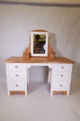 A painted pine six drawer kneehole dressing table with removable mirrored top, 56" x 21" x 31"