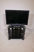 A Panasonic Viera 32" television, and a TV stand