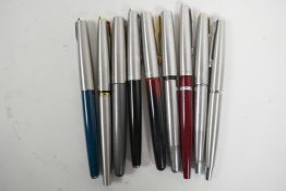 A collection of nine Parker fountain pens including gold nibs and USA