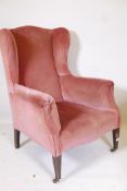 A Victorian lady's wing back armchair