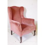 A Victorian lady's wing back armchair