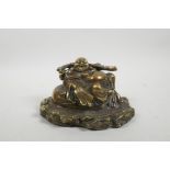 A Chinese bronze figure of a jolly Buddha reclining on a sack, impressed mark verso and to base,