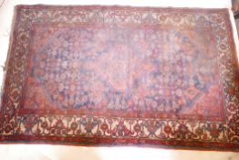 A Persian hand woven wool carpet, requiring a clean, 85" x 34"