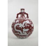 A Chinese red and white porcelain two handled moon flask with dragon and lotus flower decoration,