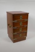 A campaign style miniature mahogany chest of four drawers with brass mounts and a leather inset top,
