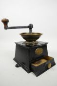 A large Victorian coffee grinder by Baldwin Son and Co, Stourport, in brass and cast iron, no.3
