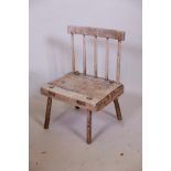 An antique pine famine/folk art chair, possibly Irish