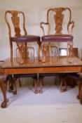 A Queen Anne style faded burr walnut drawleaf dining table, with extra leaf, carved edge top, raised