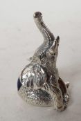 A tiny silver pincushion cast in the form of an elephant, 1¼" long