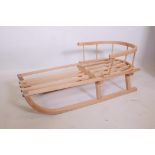 A traditional child's wooden sled, 34" long
