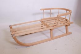 A traditional child's wooden sled, 34" long