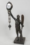 A bronze mystery clock cast in the form of a WWI pilot, 15" high