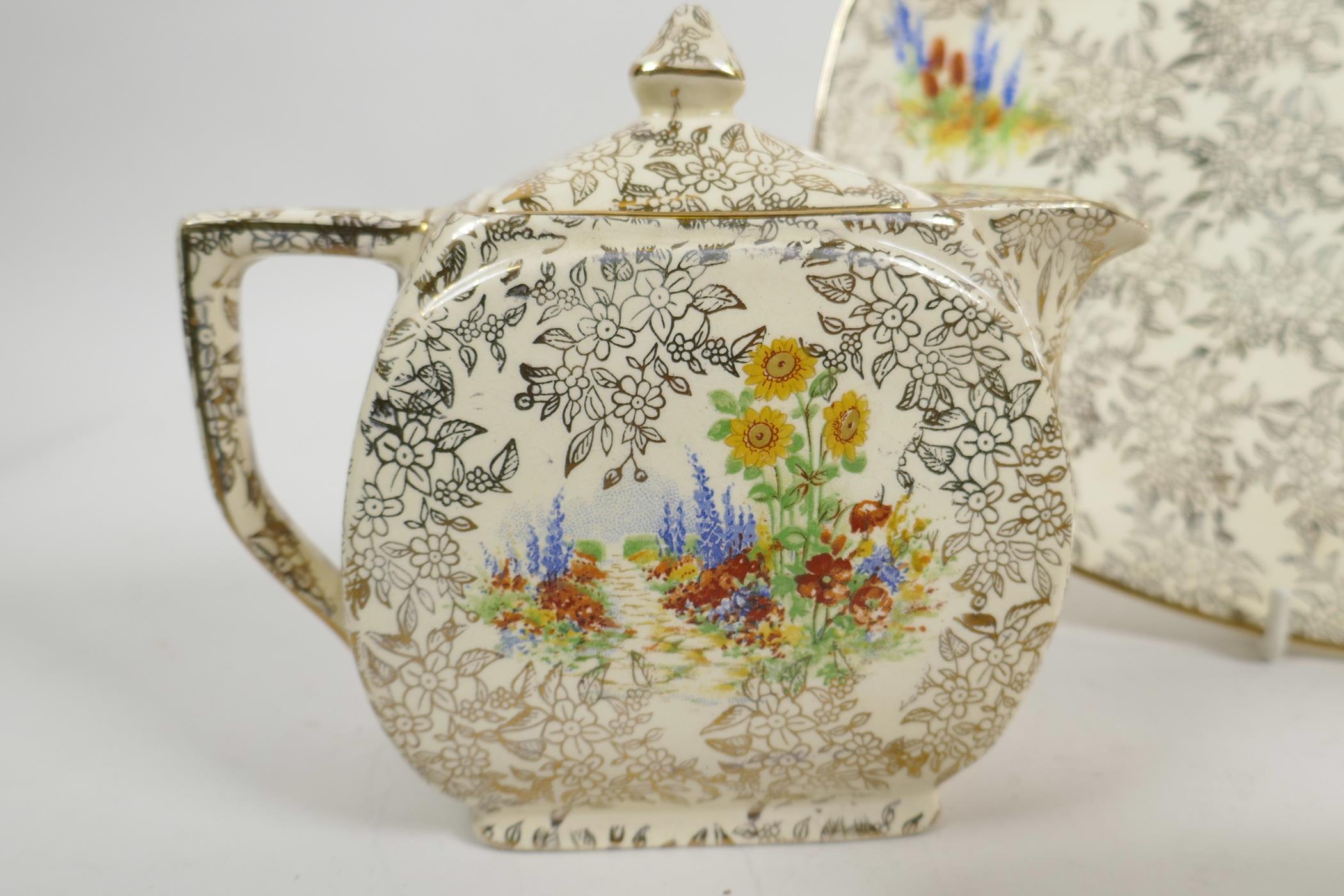 An Art Deco Empire Ware porcelain Garden Pattern teapot, water jug, milk jug and serving plate ( - Image 5 of 6