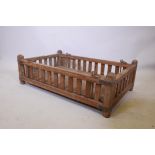 A late C19th/early C20th Indian teak hanging cot with slatted sides and brass mounts, 43" x 27",