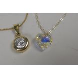 A 9ct gold chain set with a cubic zirconia pendant, and another set with a paste stone