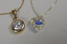 A 9ct gold chain set with a cubic zirconia pendant, and another set with a paste stone