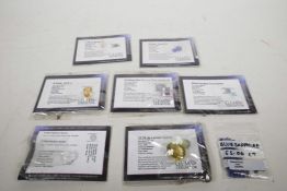 Various packaged cut gemstones supplied by 'Gem Collector', including a 32.20cts Brazilian lemon