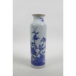 A Chinese blue and white porcelain cylinder vase decorated with birds and butterflies amongst bamboo