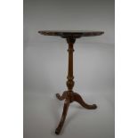 A pedestal wine table on reeded column and tripod base and leather inset top, 24" high x 15"
