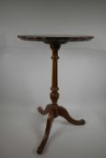 A pedestal wine table on reeded column and tripod base and leather inset top, 24" high x 15"