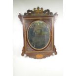 A C19th inlaid mahogany and parcel gilt mirror with carved decoration, 23½" x 33"