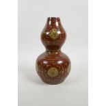 A Chinese red glazed porcelain double gourd vase with ochre ground scrolling lotus flower