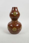 A Chinese red glazed porcelain double gourd vase with ochre ground scrolling lotus flower