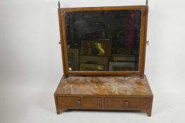An Edwardian walnut rectangular easel swing toilet mirror on two drawer base with shaped feet, 20"