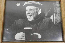 A Charles Hewitt photograph of a gentleman with a print, titled verso 'The East End 1946', 14" x 10"